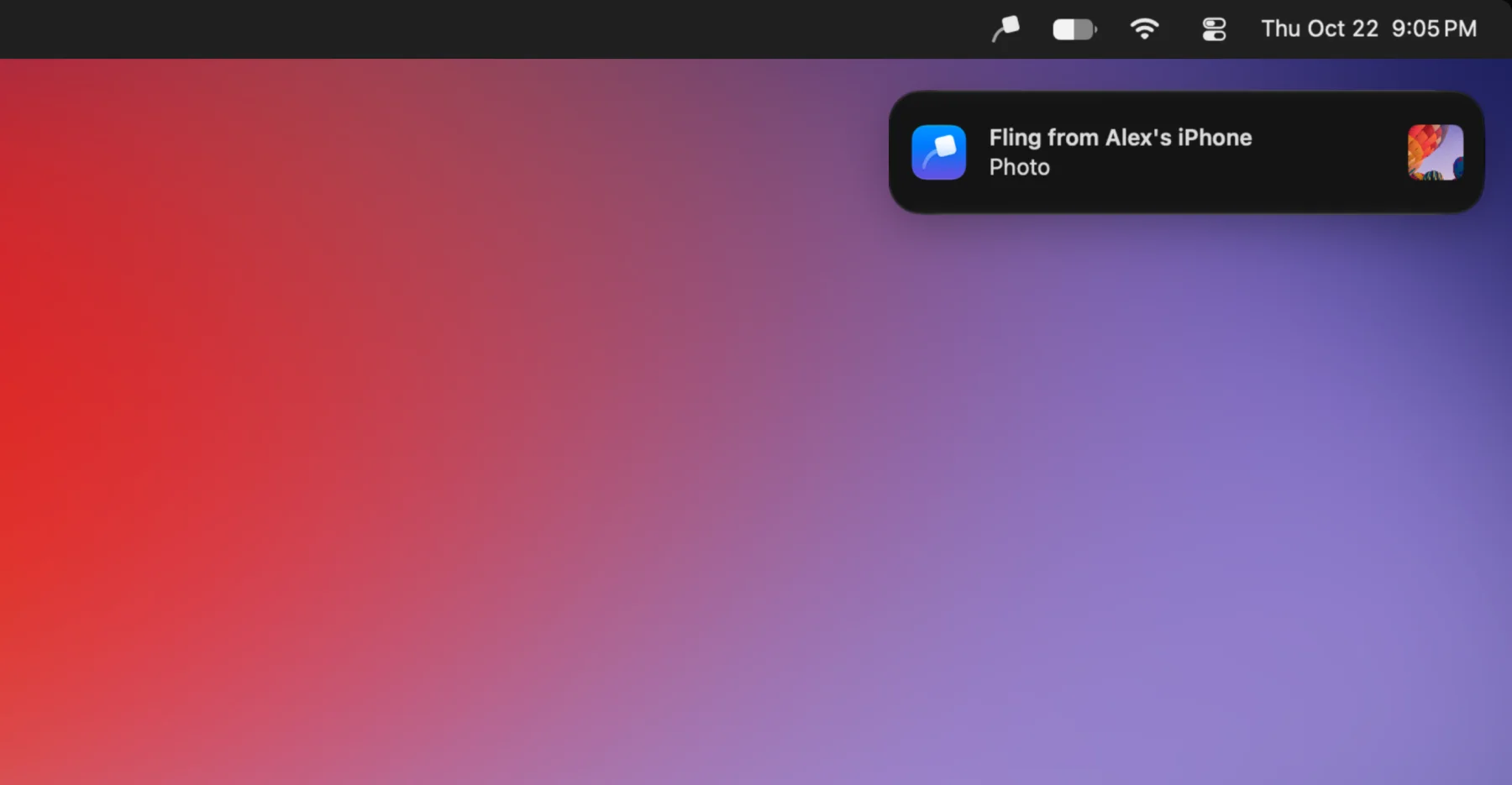 A Mac desktop with the Fling icon in the menu bar and a notification saying Fling from Alex's iPhone